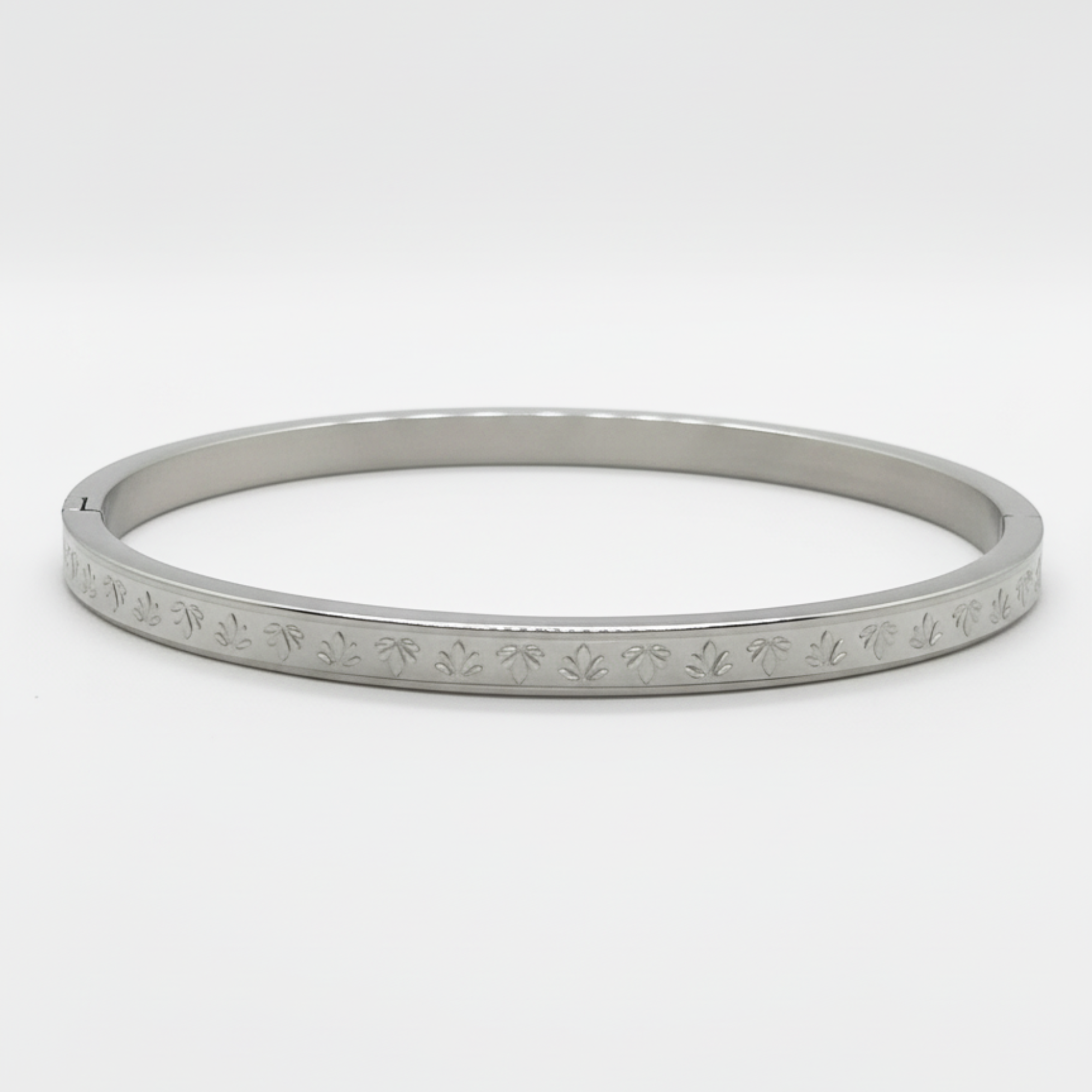 Myrithra Adjustable Stainless‑Steel Bracelet for Women | Silver‑Tone Engraved Bangle